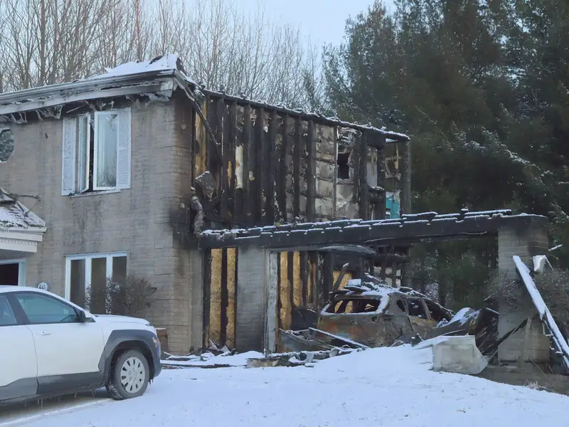 House with fire damage to the roof and upper floor