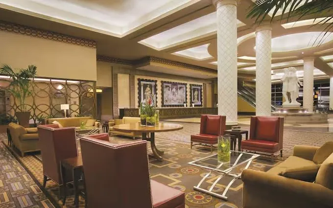 Hotel lobby lounge with armchairs and decorative columns
