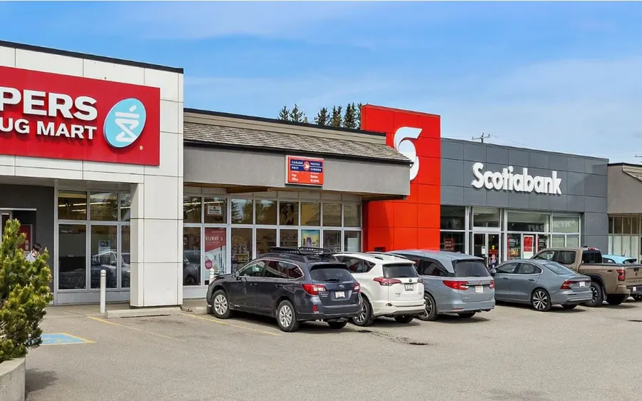 Retail plaza storefronts and parking lot